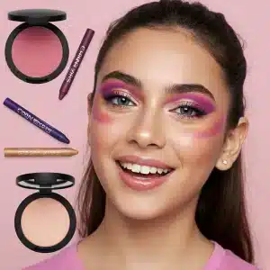 Flatlay of aura-inspired makeup products: gold highlighter, purple blush, eye crayons 2025